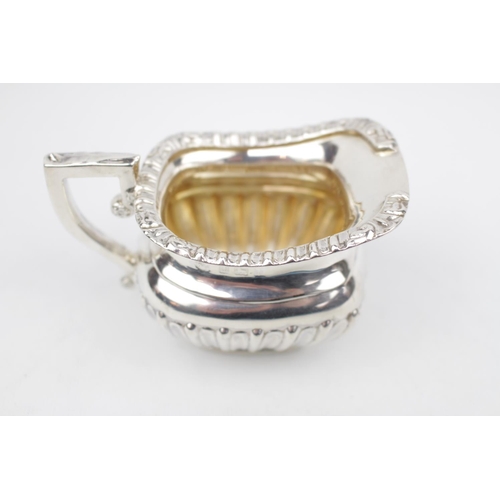 83 - Good Quality Silver Cream Jug with reed decoration by William Aitken, Birmingham 1910, 84g total wei... 