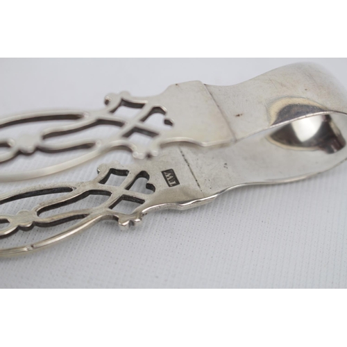 85 - Pair of 19thC Silver Scroll design sugar tongs with shell bowls by Thomas Wimbush of London, 49g tot... 