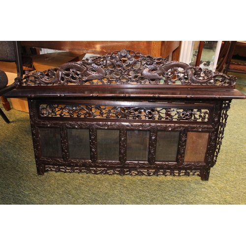 515 - Chinese Republic Hardwood carved over mantel of single shelf over 6 glazed panels, decorated with su... 