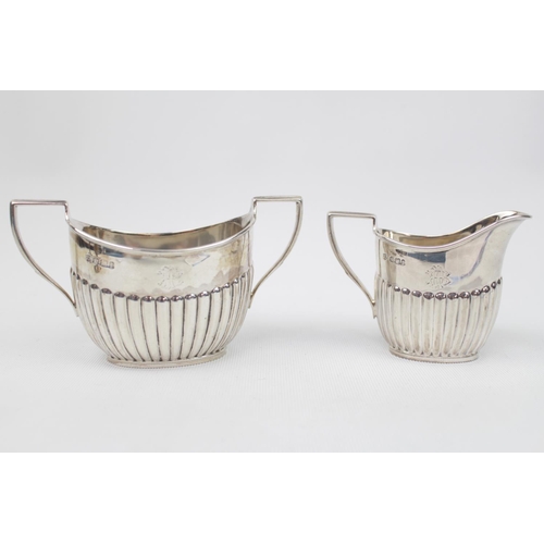 195 - Victorian Silver matching Sugar bowl and Cream jug of fluted design on rimmed foot, engraved initial... 