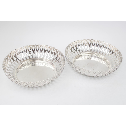 216 - Pair of George V Silver fruit bowls with pierced sides on heavy circular base. 18cm in Diameter. She... 