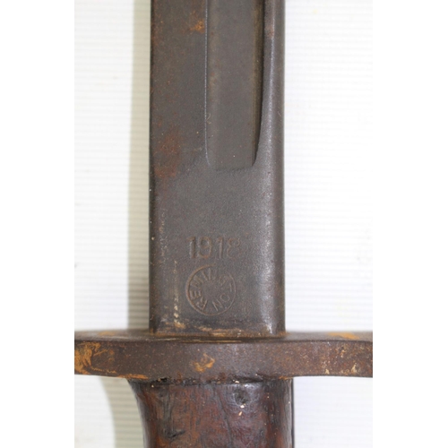 141 - Remington made Model 1918 bayonet as fitted to the US Model 1917 rifle with scabbard. 56cm in Length