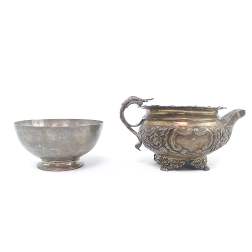 192 - 20thC Silver Sugar Bowl London 1959 and a 19thC Silver Foliate decorated water jug (markings rubbed)... 