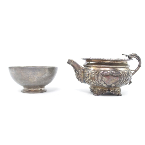 192 - 20thC Silver Sugar Bowl London 1959 and a 19thC Silver Foliate decorated water jug (markings rubbed)... 