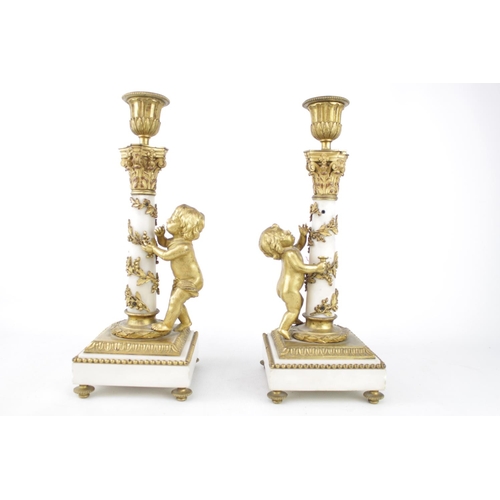 35 - Pair of 19th century Louis XVI candlesticks of white Carrara marble and Ormolu design. 30cm in Heigh... 