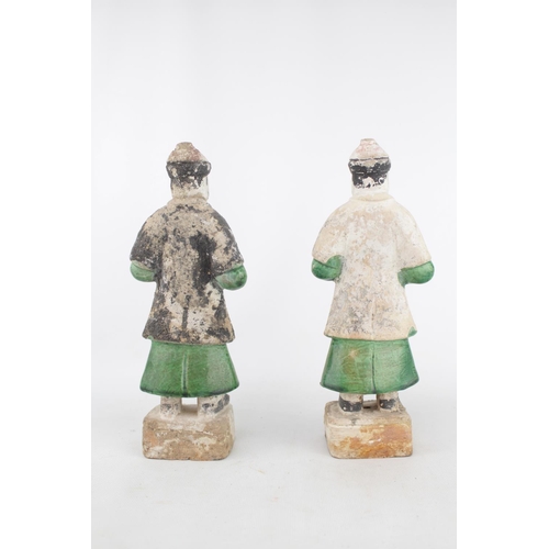 41 - Pair of Chinese green and amber lead-glazed pottery funerary figures in the form of attendants. Each... 