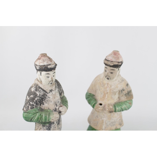 41 - Pair of Chinese green and amber lead-glazed pottery funerary figures in the form of attendants. Each... 