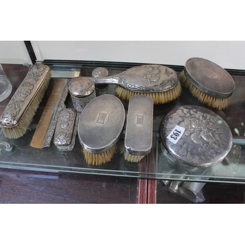 193 - Part Harlequin set of Silver Cherub decorated dressing table wares and a Deco Part Silver backed dre... 