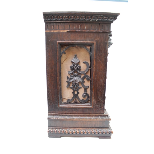 72 - Oak cased 19thC Bracket clock with highly carved domed case. Silvered dial with roman numerals. 37cm... 