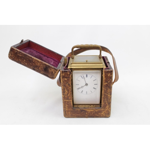 73 - A late 19thC Brass carriage clock, with white enamel dial signed Dent, quarter repeating with carria... 