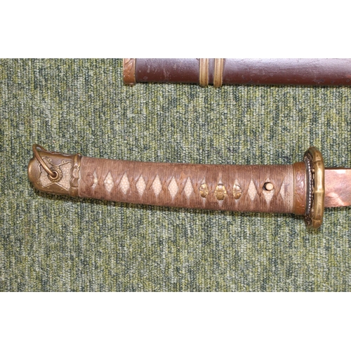 227 - WWII era Japanese Katana/Samurai Sword: Sword with decorative Tsuba with embossed cherry blossom. Sh... 