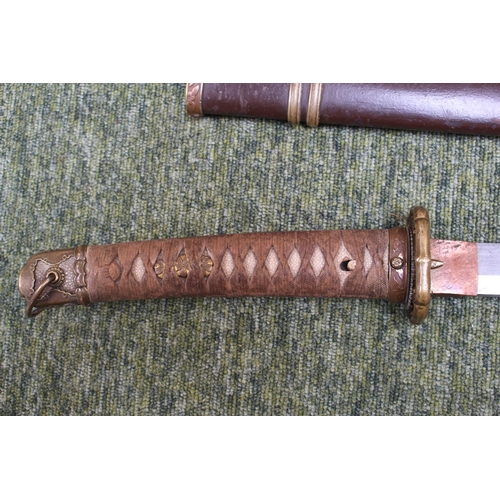 227 - WWII era Japanese Katana/Samurai Sword: Sword with decorative Tsuba with embossed cherry blossom. Sh... 