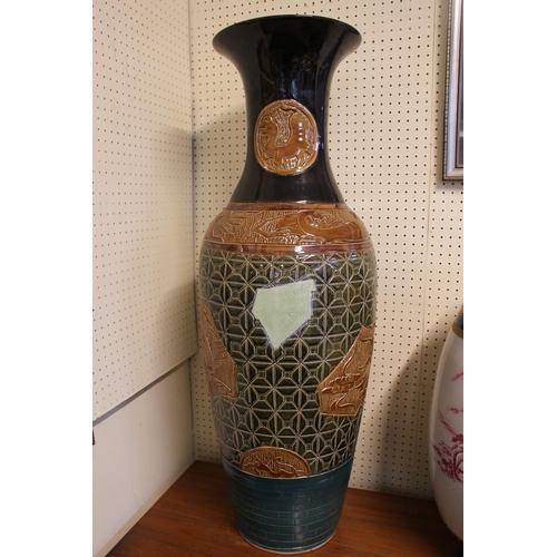 91 - Tall 20thC Chinese Pottery vase with carved panels depicting Dragons a Outcrops. 97cm in Height