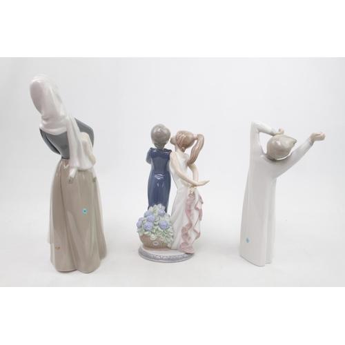 317 - Collection of 3 Lladro figure of a Courting Couple, Woman with Lamb and a Boy waking