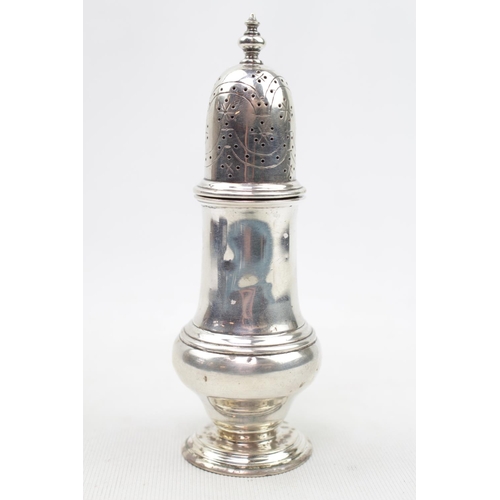 383 - A Silver Georgian style caster with baluster finial 14cm high, London 1935. 111g total weight