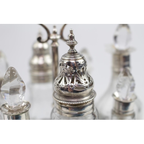 408 - Fine George III Silver 8 Piece Cruet stand of oval pierced form with a set of matching cruet bottles... 