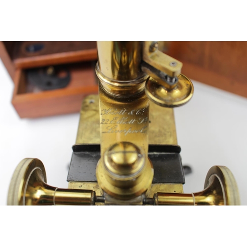 324 - A Victorian Knott & Co of Liverpool lacquered brass cased monocular compound microscope, in fitted m... 