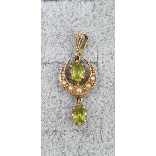 417 - Edwardian 9ct Gold Peridot and Seed pearl set Crescent drop pendant. 3cm in Length. 1.7g total weigh... 