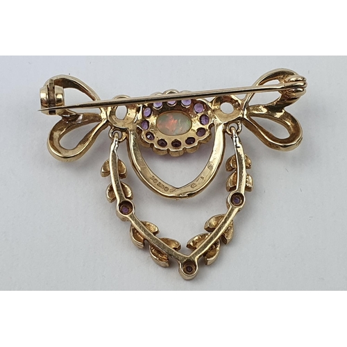 431 - Fine 9ct Gold Opal and Amethyst set brooch. Central Oval rub over set opal surrounded by circular am... 