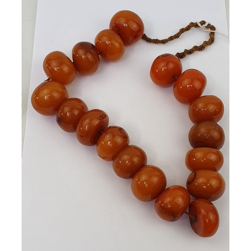 439 - Very Large Amber bead necklace, comprising 18 Eighteen butterscotch amber beads measuring 48cm in Le... 