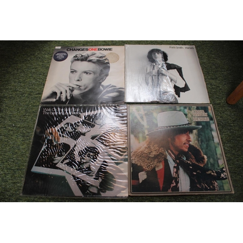 320a - Collection of Vinyl Record to include Eric Clapton. Sade, Bob Dylan etc