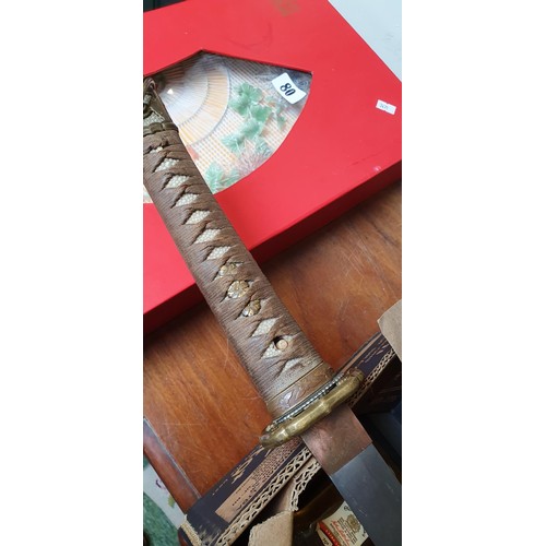 227 - WWII era Japanese Katana/Samurai Sword: Sword with decorative Tsuba with embossed cherry blossom. Sh... 