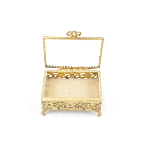 321 - Good quality Gilt Metal Bijoux jewel box of foliate decoration with bevelled glass hinged top