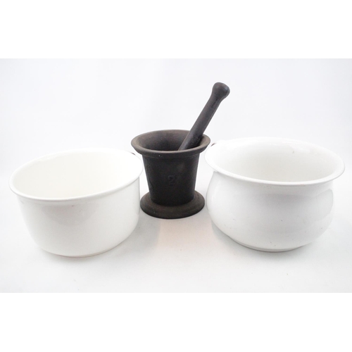 57 - Cast iron Pestle and Mortar and 2 Chamber pots