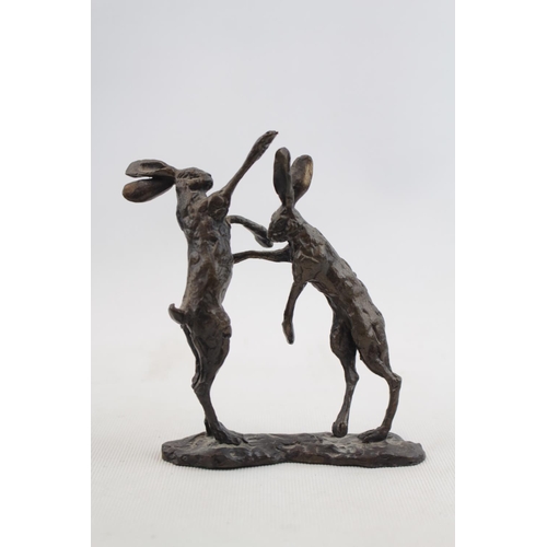 86 - Bronze of Boxing Hares in style of Paul Jenkins. Signed to base. 12cm in height