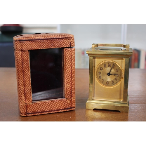 58 - French Carriage clock with numeral dial and Leatherette fitted case 15cm. Lion mark to reverse