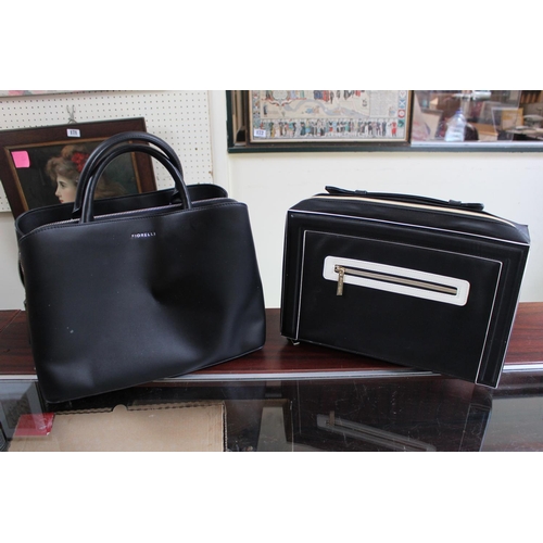 132 - Fiorelli Ladies Black Leather Classic Grab Bag and a Estee Lauder Bag