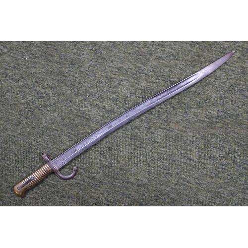 237 - 19thC French Curved Bayonet with brass handle