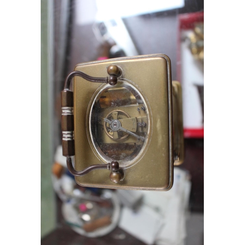 240 - Voked of Paris Brass cased Carriage clock with roman numeral dial with key