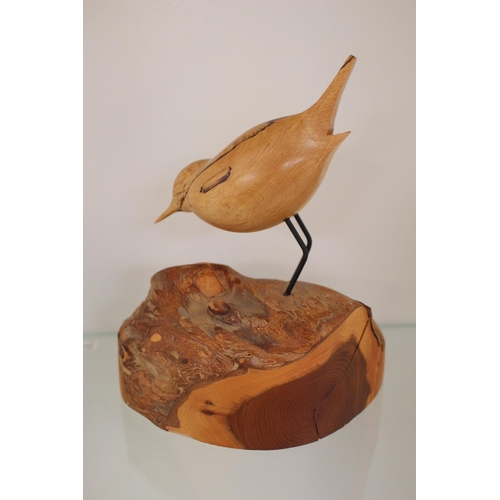 73 - Bruno Sharron, The Wood Studio carving of bird on a log . 20cm in Height