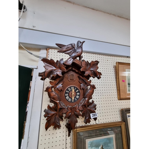 203 - Black Forest Wall clock with roman numeral dial, complete with weights and pendulum