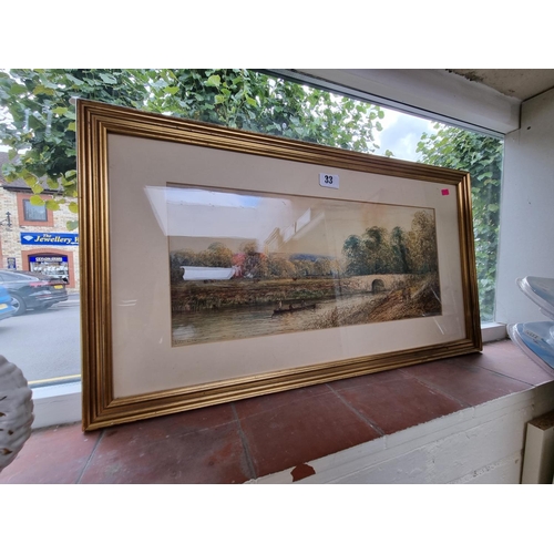 33 - Gilt framed Watercolour of a river scene signed to bottom left