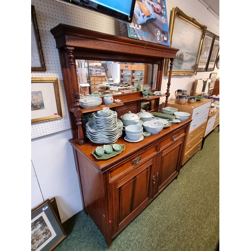 306 - Edwardian Walnut mirror backed dresser with brass drop handles and panel doors