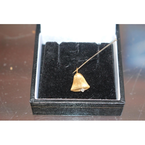 249 - 18ct Gold Bell pendant with Diamond setting