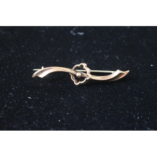 251 - Ladies 9ct Gold Bar brooch of wavy design 1.2g total weight