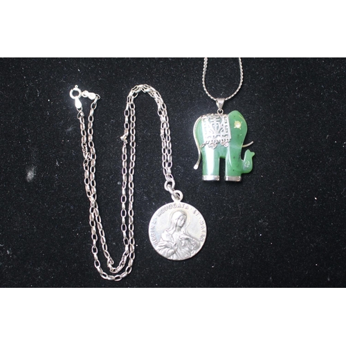 276 - Silver and Jade Elephant Pendant on chain and a Coin type pendant on chain