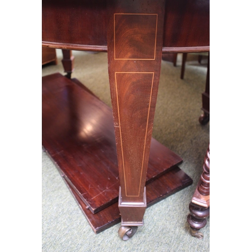 303 - Edwardian wind out table with two leaves on brass casters with winder