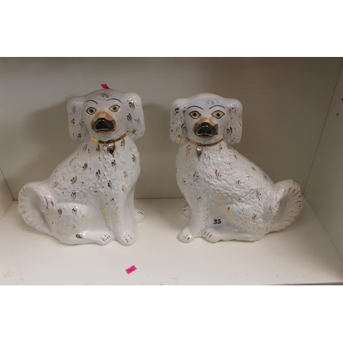 35 - Pair of Large Staffordshire Fireside dogs with gilt applied decoration