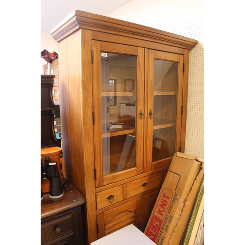 363 - Pine glazed bookcase with cupboard under tier