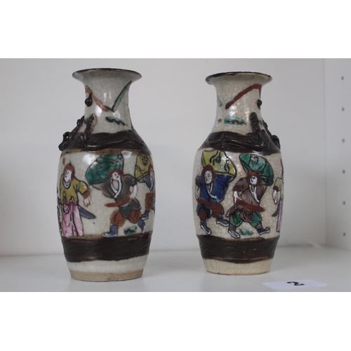 2 - Pair of Late 19thC Chinese crackle glaze vases figural decorated with carved character marks to base... 