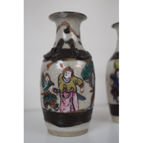 2 - Pair of Late 19thC Chinese crackle glaze vases figural decorated with carved character marks to base... 