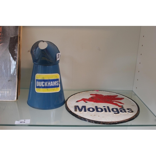 33 - Duckhams Oil Can and a Cast Iron Mobilgas sign