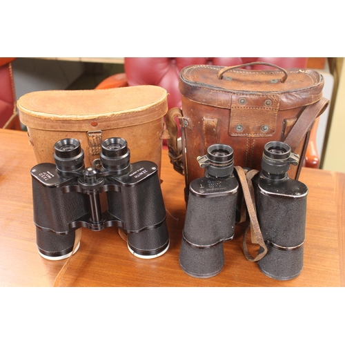 9 - Leather cased set of Dienstglas 7 x 50 bmk binoculars and a Pair of Zenith Binoculars