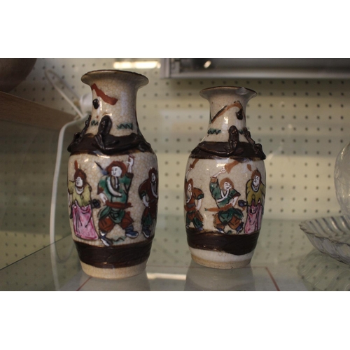 15 - Pair of Late 19thC Chinese crackle glaze vases figural decorated with carved character marks to base... 