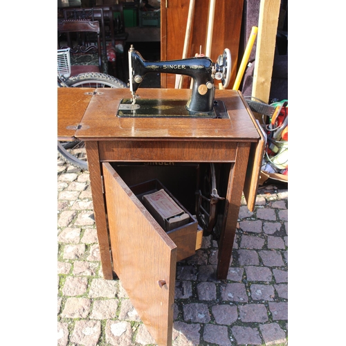 402 - Oak cased sewing machine