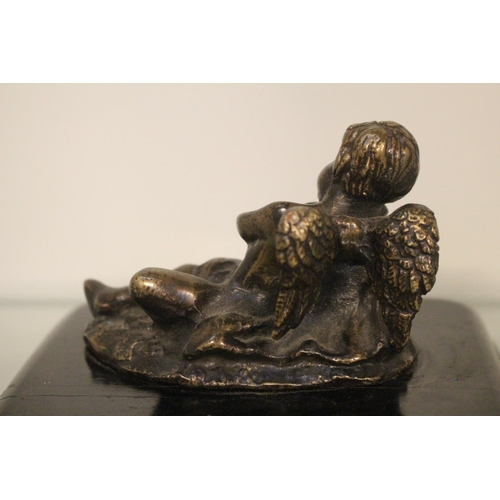 59 - Bronze sculpture of an Angel / Putti mounted on wooden base 10cm in Length